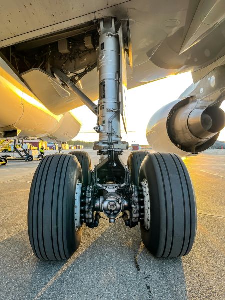 closeup of an airplane's landing gear, illustrating one use case for aerospace metal finishing services