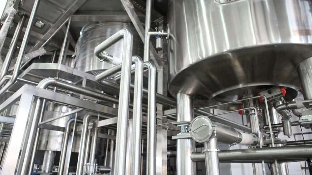 stainless steel vats in an industrial setting, illustrating a common use for 316 stainless
