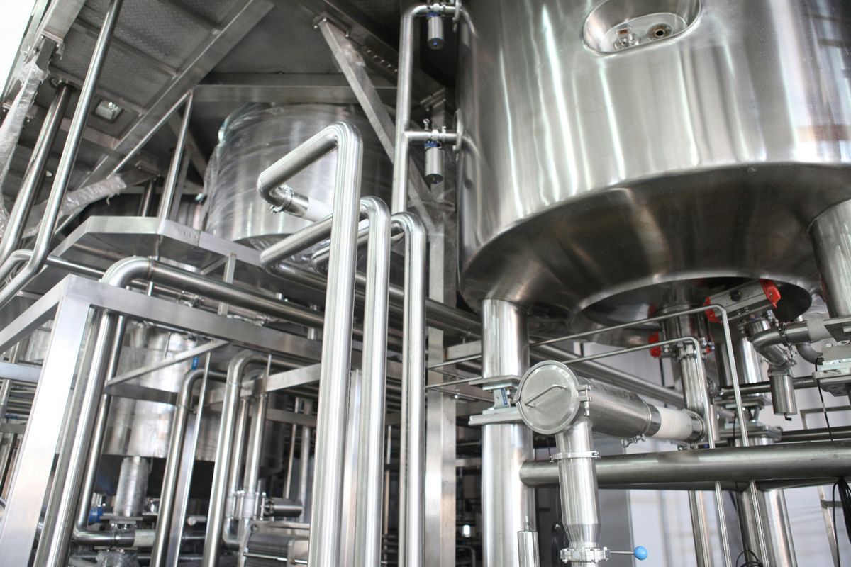 stainless steel vats in an industrial setting, illustrating a common use for 316 stainless