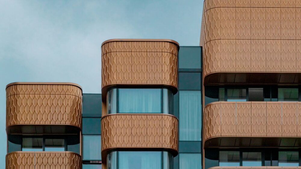 exterior of a contemporary building that uses bronze in its architecture