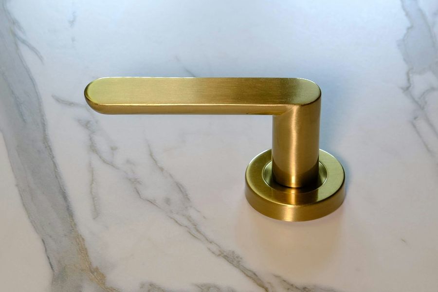 a handle made with a brushed brass finish