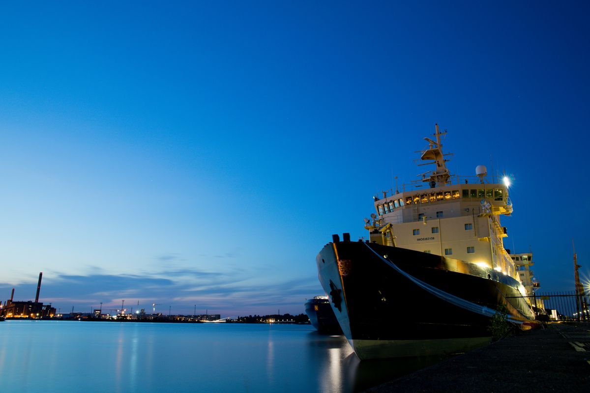 a ship moored in a shipyard, potentially with Muntz components